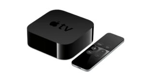 Sleek design of an apple tv box console alongside its minimalist remote control